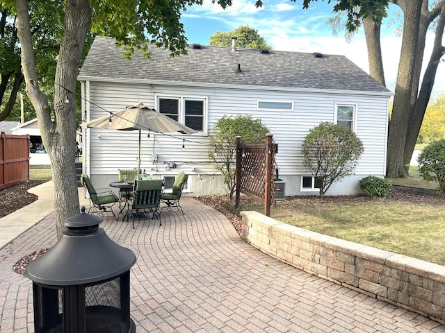 back of house with a patio