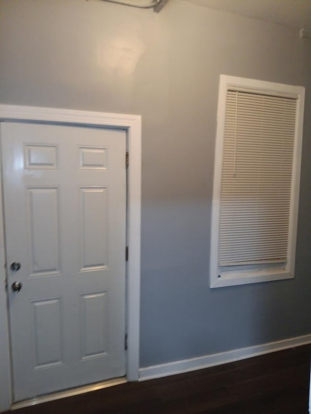 interior space with dark hardwood / wood-style flooring