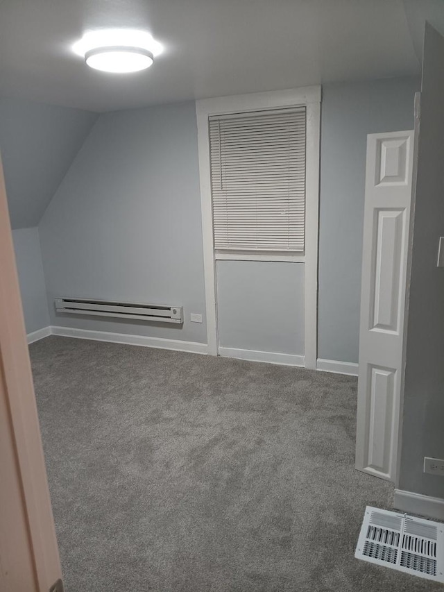 bonus room featuring carpet, vaulted ceiling, and baseboard heating