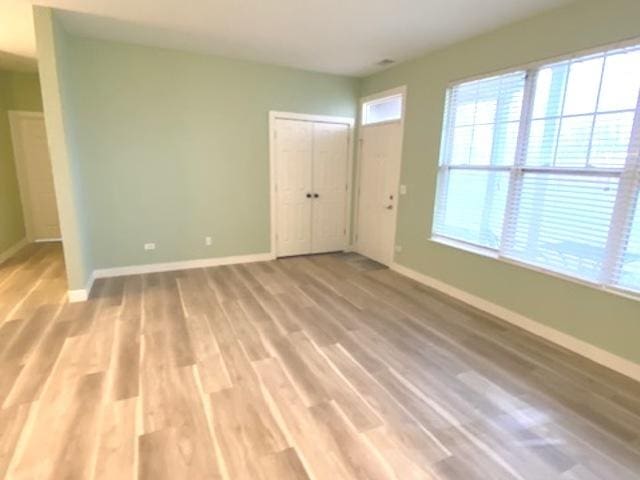 spare room with hardwood / wood-style flooring