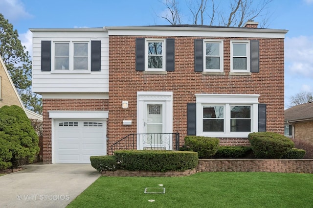 view of front of house with a garage and a front lawn