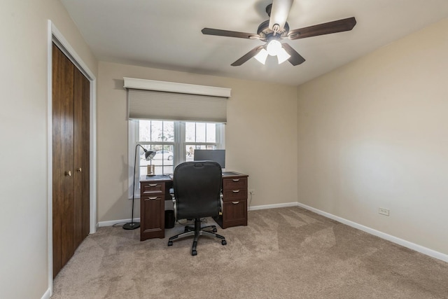 carpeted office with ceiling fan