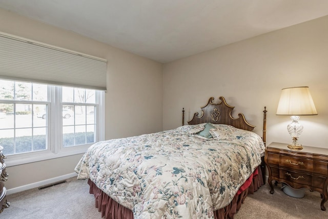 bedroom with light colored carpet