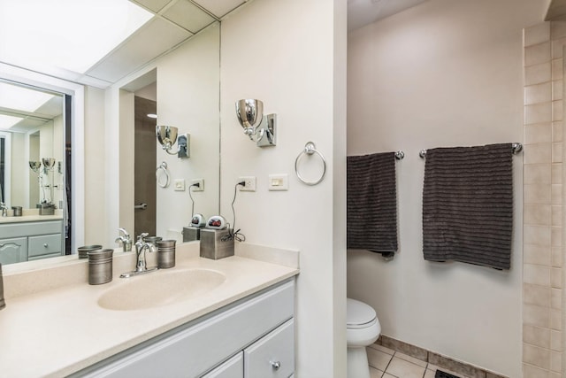 bathroom with tile patterned floors, vanity, and toilet