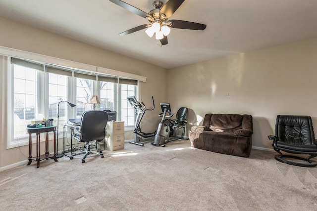 exercise room with carpet floors and ceiling fan