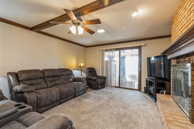 carpeted living room featuring beam ceiling, ceiling fan, and crown molding