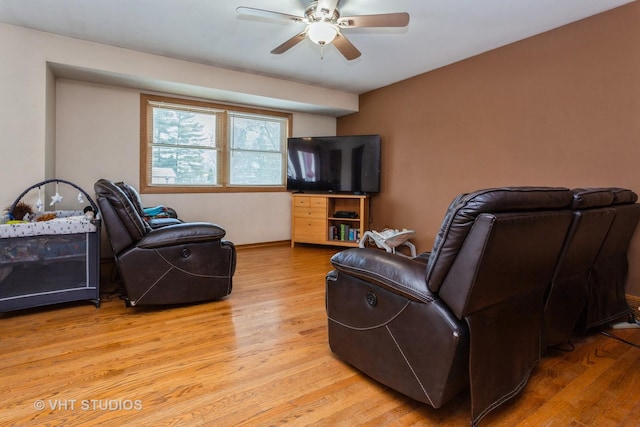 living room with ceiling fan and light hardwood / wood-style floors