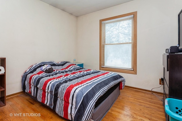 bedroom with light wood-type flooring