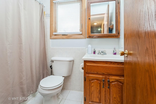 bathroom with tile patterned flooring, vanity, and toilet