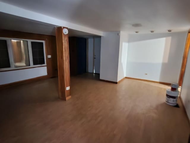 unfurnished room with hardwood / wood-style floors