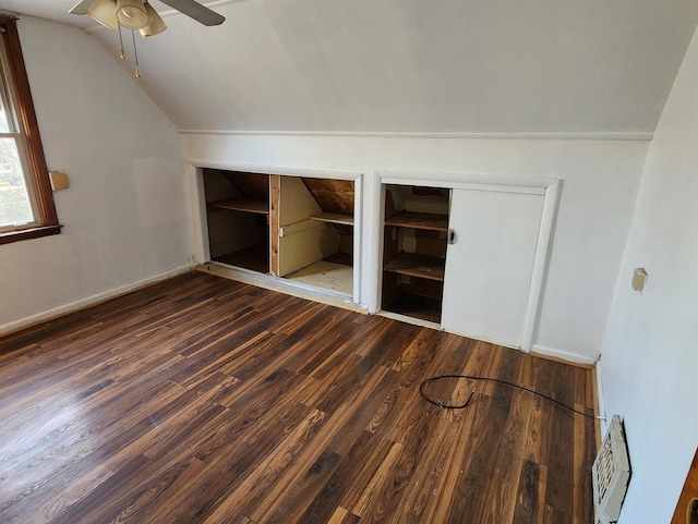 bonus room with ceiling fan, dark hardwood / wood-style flooring, and vaulted ceiling