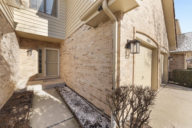 view of exterior entry featuring a garage