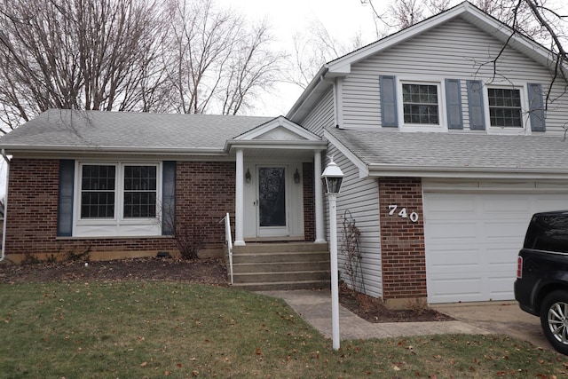 view of front facade featuring a front lawn and a garage