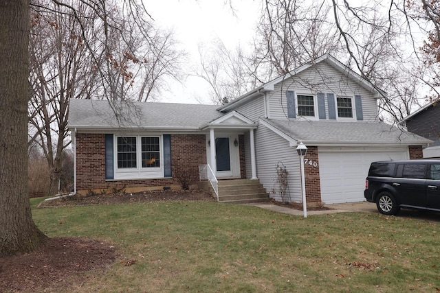 tri-level home with a garage and a front lawn