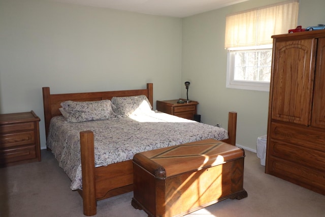 bedroom with light colored carpet