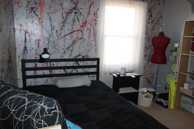 bedroom with carpet floors and multiple windows