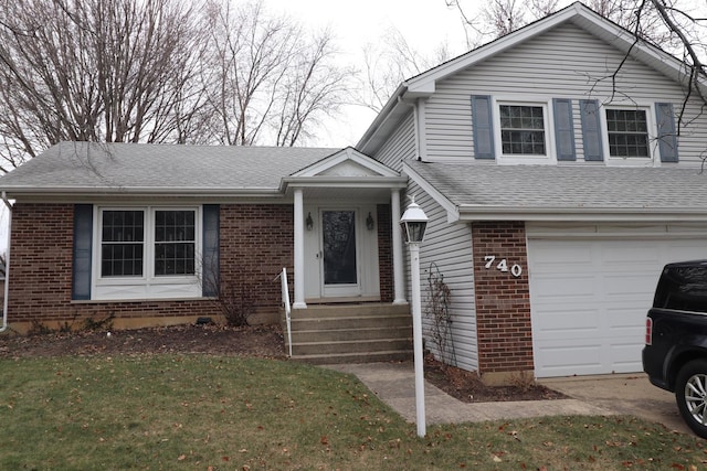 view of front facade with a front lawn and a garage