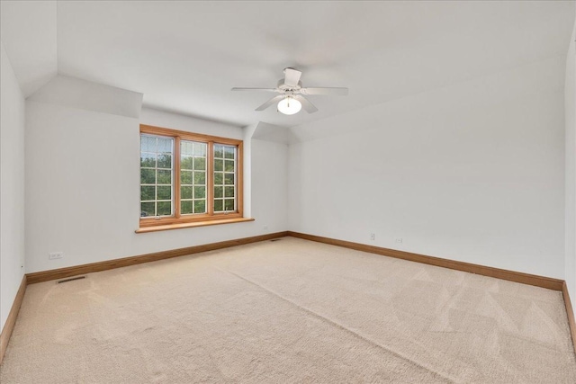 16001 Burr Oak Dr, Huntley, IL 60142 - spare room featuring carpet, ceiling fan, lofted ceiling, and baseboards