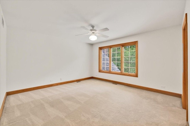 16001 Burr Oak Dr, Huntley, IL 60142 - unfurnished room featuring baseboards, light carpet, and a ceiling fan