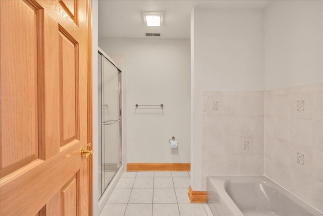 16001 Burr Oak Dr, Huntley, IL 60142 - full bath with tile patterned flooring, a stall shower, a bath, and baseboards