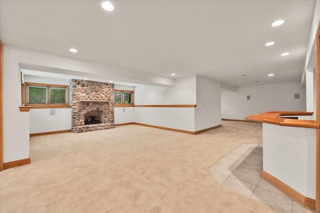 16001 Burr Oak Dr, Huntley, IL 60142 - unfurnished living room with light carpet, recessed lighting, baseboards, and a stone fireplace