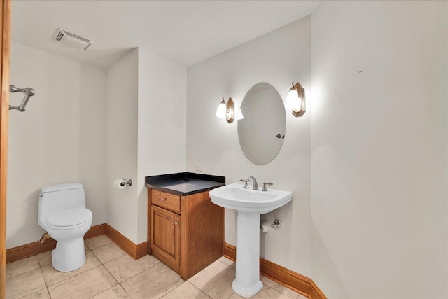 16001 Burr Oak Dr, Huntley, IL 60142 - half bathroom featuring toilet, baseboards, tile patterned flooring, and a sink