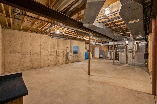 16001 Burr Oak Dr, Huntley, IL 60142 - unfinished below grade area with water heater and a water pressure tank