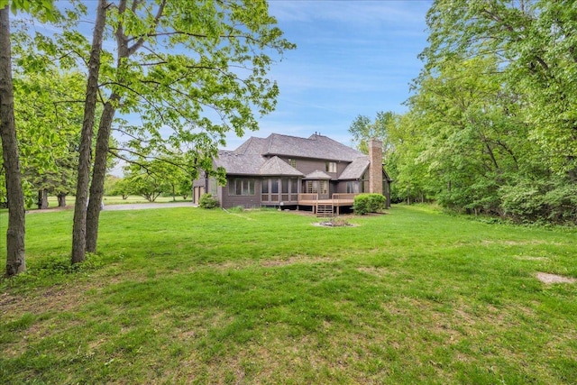 16001 Burr Oak Dr, Huntley, IL 60142 - rear view of property with a deck, a yard, and a chimney