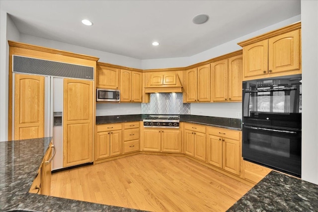 16001 Burr Oak Dr, Huntley, IL 60142 - kitchen featuring stainless steel appliances, light wood-style floors, dark stone countertops, backsplash, and recessed lighting