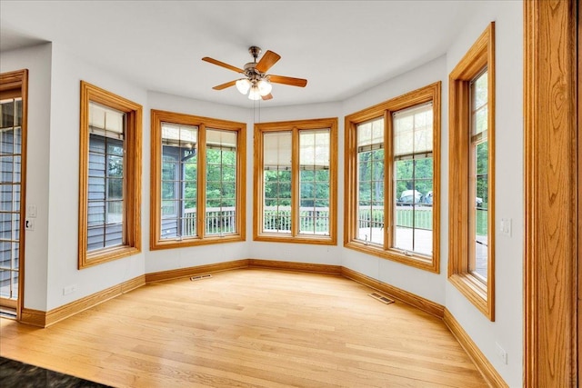 16001 Burr Oak Dr, Huntley, IL 60142 - unfurnished sunroom with wood finished floors, healthy amount of natural light, and baseboards