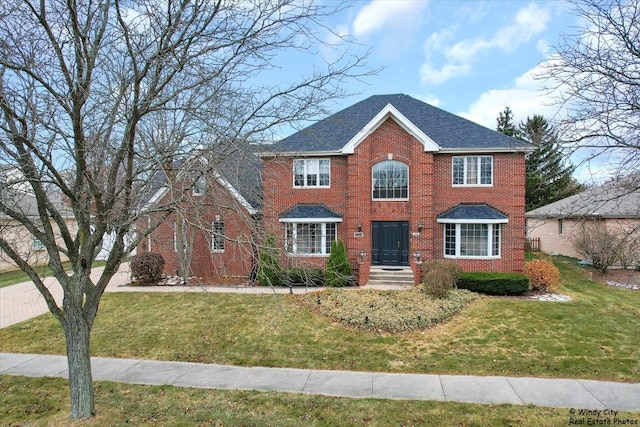 17224 Briar Dr, Tinley Park, IL 60487 - colonial-style house with a front lawn and brick siding
