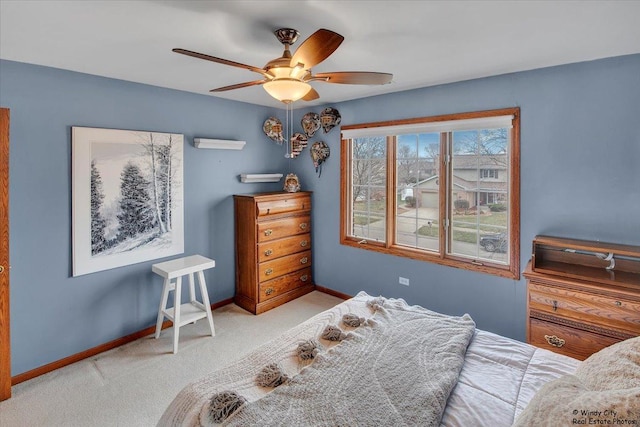 bedroom with ceiling fan and light colored carpet