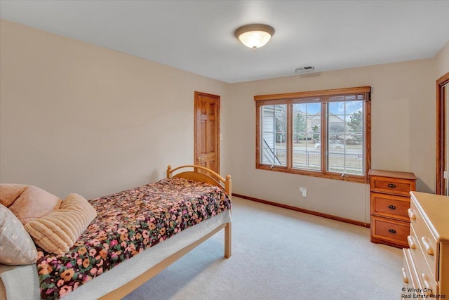 bedroom with light carpet