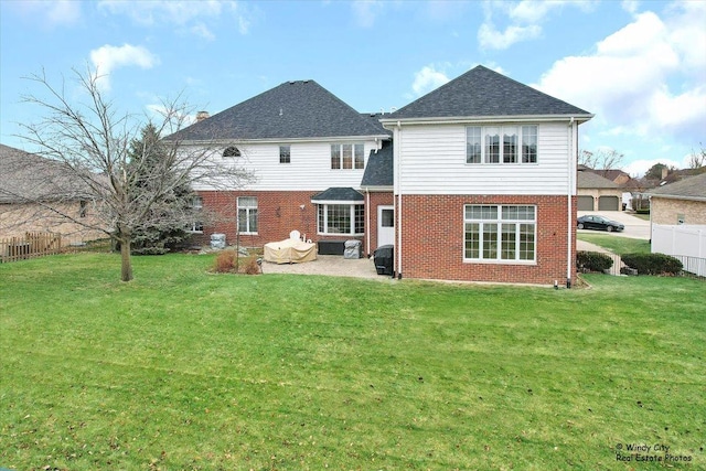 back of property featuring a lawn and a patio area