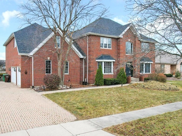 17224 Briar Dr, Tinley Park, IL 60487 - view of front of home with brick siding, decorative driveway, a front lawn, and roof with shingles