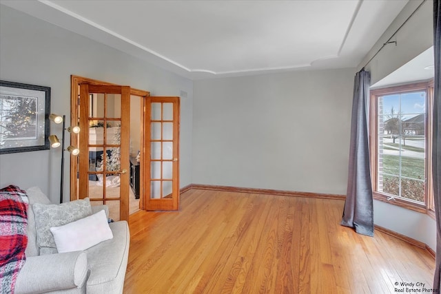 17224 Briar Dr, Tinley Park, IL 60487 - sitting room featuring french doors, light wood-type flooring, and baseboards