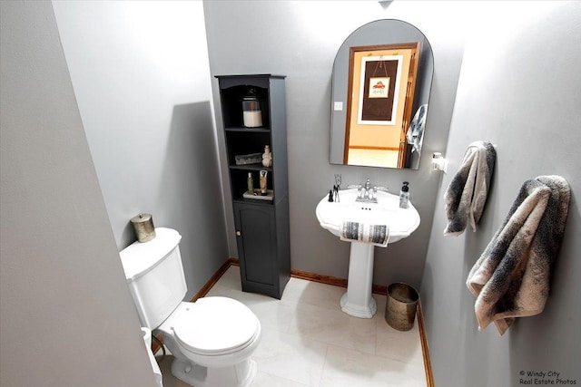 bathroom featuring tile patterned flooring and toilet