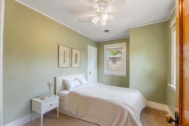 bedroom featuring ceiling fan, light colored carpet, and ornamental molding