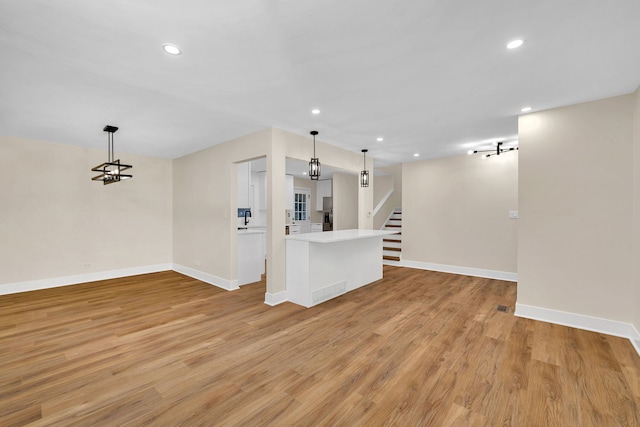 unfurnished living room with light wood-type flooring