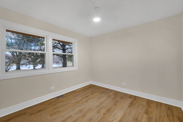 spare room with light hardwood / wood-style flooring