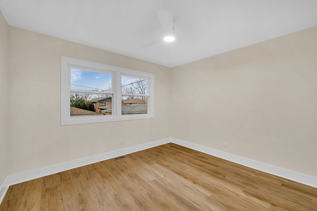 unfurnished room with light hardwood / wood-style flooring