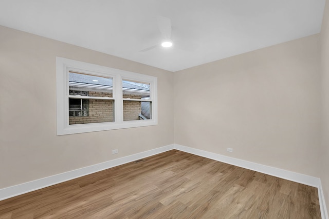 empty room featuring ceiling fan and light wood-type flooring