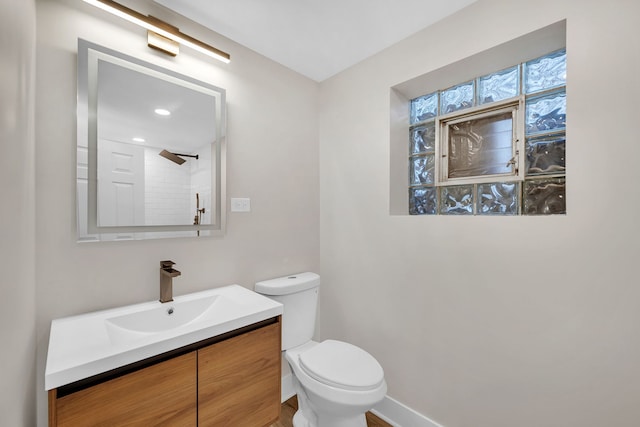 bathroom with vanity and toilet