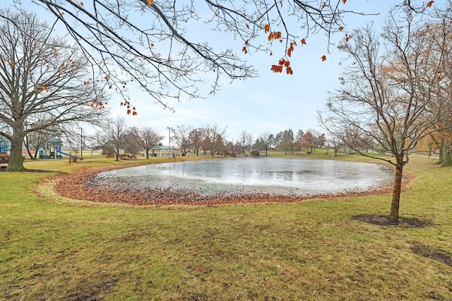 exterior space featuring a water view and a lawn