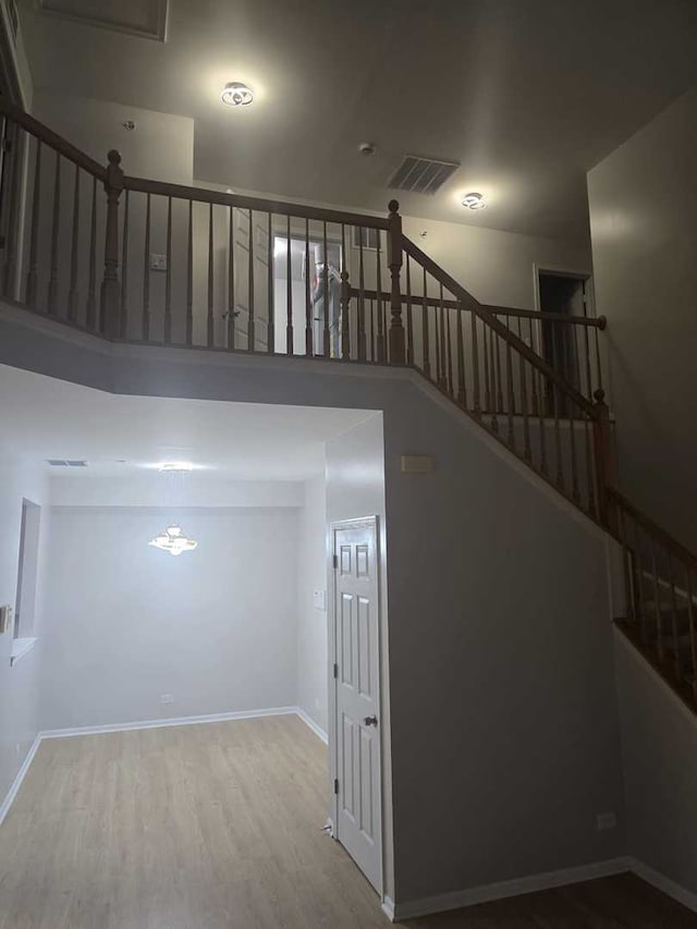 stairs featuring hardwood / wood-style floors