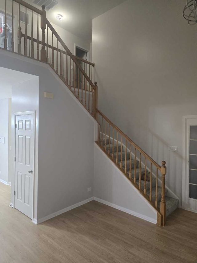 stairway featuring hardwood / wood-style floors