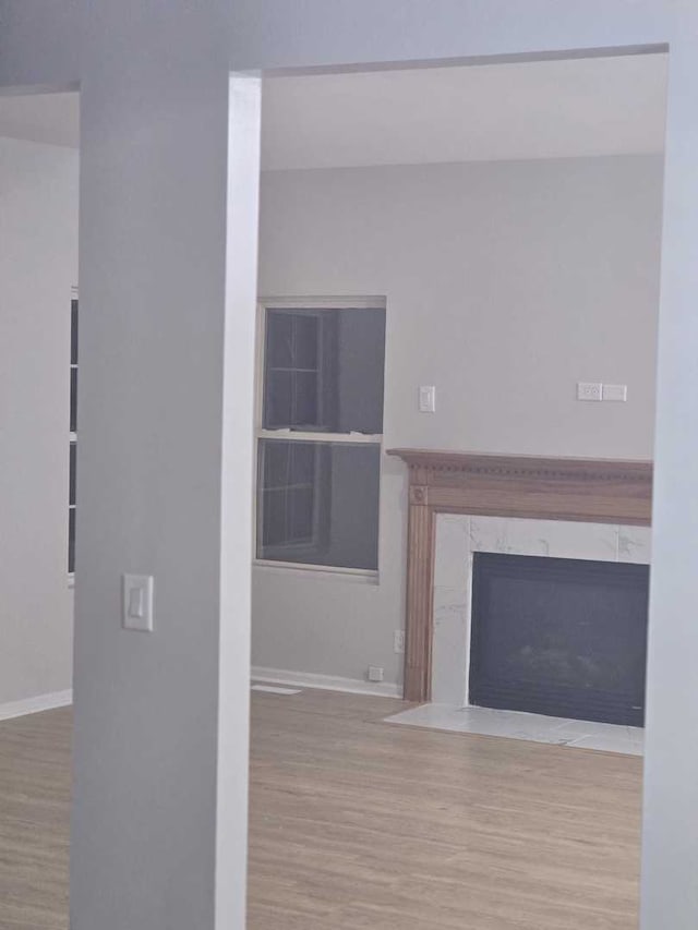 unfurnished living room featuring hardwood / wood-style flooring