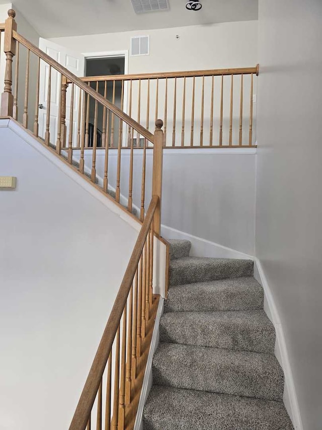 stairway with carpet flooring