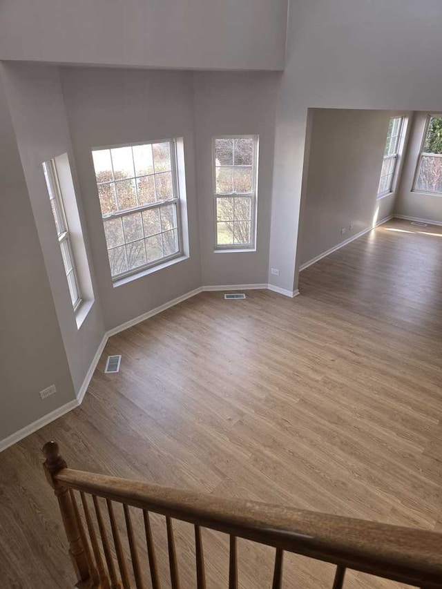 unfurnished living room with wood-type flooring