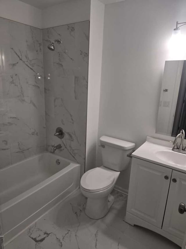 full bathroom featuring toilet, vanity, and tiled shower / bath